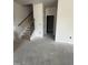 A modern stairway with wooden handrail and black iron spindles at 14 E American Marigold Dr # 65, Benson, NC 27504