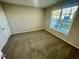 Spacious bedroom featuring a large window and carpet at 2107 Lambert Rd # 64, Cary, NC 27519