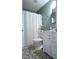 Full bathroom with white vanity, mosaic tile floor, and shower at 216 Parrish Farm Lane Ln, Benson, NC 27504