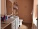 Bathroom with a single vanity and floral decorations at 216 Parrish Farm Lane Ln, Benson, NC 27504