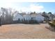 Side view of the house showing landscaping and yard at 216 Parrish Farm Lane Ln, Benson, NC 27504