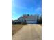 Charming single-story home featuring a two-car garage, well-maintained lawn, and a classic design, perfect for comfortable living at 216 Parrish Farm Lane Ln, Benson, NC 27504