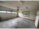 Large garage with a garage door, shelving, and an opener at 216 Parrish Farm Lane Ln, Benson, NC 27504