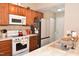 Close-up of kitchen featuring stainless steel appliances and tiled backsplash at 216 Parrish Farm Lane Ln, Benson, NC 27504