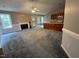 Spacious living room featuring a fireplace, ceiling fan, and open access to the kitchen area at 216 Parrish Farm Lane Ln, Benson, NC 27504