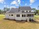 Two-story home with screened porch and landscaped yard at 2404 Toll Mill Ct, Raleigh, NC 27606