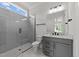 Modern bathroom with gray tile shower and vanity at 2404 Toll Mill Ct, Raleigh, NC 27606