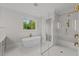 Elegant bathroom with freestanding tub and walk-in shower at 2404 Toll Mill Ct, Raleigh, NC 27606