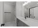 Bathroom with gray vanity, white countertop, and a walk-in shower at 2404 Toll Mill Ct, Raleigh, NC 27606