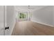 Bright and airy bedroom with hardwood floors and large window at 2404 Toll Mill Ct, Raleigh, NC 27606