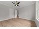 Bright bedroom with hardwood floors and ceiling fan at 2404 Toll Mill Ct, Raleigh, NC 27606