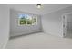 Spacious bedroom with carpeted floors and large windows at 2404 Toll Mill Ct, Raleigh, NC 27606