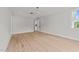 Spacious bedroom with hardwood floors and access to a kitchenette at 2404 Toll Mill Ct, Raleigh, NC 27606