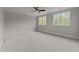 Spacious bedroom with plush carpeting and large windows at 2404 Toll Mill Ct, Raleigh, NC 27606