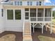 Two-story home with screened porch and wooden stairs at 2404 Toll Mill Ct, Raleigh, NC 27606