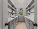 Bright walk-in pantry with ample shelving and a built-in sink at 2404 Toll Mill Ct, Raleigh, NC 27606