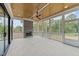 Relaxing screened porch with fireplace and wood ceiling at 2404 Toll Mill Ct, Raleigh, NC 27606