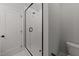 Clean shower with glass enclosure and white tile at 2404 Toll Mill Ct, Raleigh, NC 27606