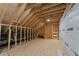 Unfinished attic space with exposed beams and HVAC system at 2404 Toll Mill Ct, Raleigh, NC 27606