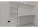 Large walk-in closet with shelves and hanging rods at 2404 Toll Mill Ct, Raleigh, NC 27606
