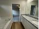 Bathroom with granite countertops and a garden tub at 257 Magnolia Run Way, Benson, NC 27504