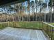 Wooden deck overlooking a grassy backyard and trees at 257 Magnolia Run Way, Benson, NC 27504