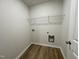 Laundry room with wire shelving and space for washer/dryer at 257 Magnolia Run Way, Benson, NC 27504