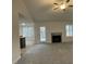 Spacious living room with fireplace, high ceilings and carpeting at 257 Magnolia Run Way, Benson, NC 27504