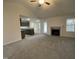 Open living room with a view of kitchen and fireplace at 257 Magnolia Run Way, Benson, NC 27504