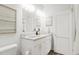 Bathroom with white vanity, double sinks, and modern fixtures at 3019 White Rail Dr, Fuquay Varina, NC 27526