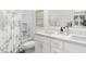 Bright bathroom with double sinks, white vanity, and shower at 3019 White Rail Dr, Fuquay Varina, NC 27526