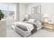Bedroom showcasing a gray bed frame, neutral bedding, and natural light at 3019 White Rail Dr, Fuquay Varina, NC 27526