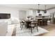 Open dining area features modern decor, hardwood floors, and lots of natural light at 3019 White Rail Dr, Fuquay Varina, NC 27526