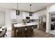 Modern kitchen with stainless steel appliances, white cabinetry, and kitchen island at 3019 White Rail Dr, Fuquay Varina, NC 27526