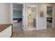 Hallway view features carpeted floors, white walls, and doorways to a bathroom and bedrooms at 412 Jerome Rd, Durham, NC 27713