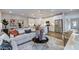 Inviting living room flowing into a modern kitchen with stainless steel appliances at 8701 Wardle Ct, Wake Forest, NC 27587