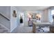 Well-lit home office space with a modern desk, office chair, and stylish decor and access to the second floor at 8701 Wardle Ct, Wake Forest, NC 27587