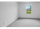 Carpeted bedroom with natural light through a window at 8703 Wardle Ct, Wake Forest, NC 27587