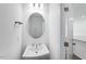 Clean powder room featuring a modern sink, mirror and hardware at 8703 Wardle Ct, Wake Forest, NC 27587