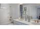 Bright bathroom with double sinks, white cabinets, gold fixtures, and a shower-tub combination at 8714 Wardle Ct, Wake Forest, NC 27587