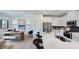 Bright kitchen with stainless steel appliances, a large island and an adjacent dining area at 8714 Wardle Ct, Wake Forest, NC 27587