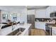 Modern kitchen with stainless steel appliances, white cabinets, a kitchen island and pendant lighting at 8714 Wardle Ct, Wake Forest, NC 27587