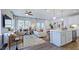 Open-concept living space features a comfortable seating area, dining area, and modern kitchen at 8716 Wardle Ct, Wake Forest, NC 27587