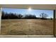 Open backyard with mature trees at 90 Faucette Dr, Selma, NC 27576