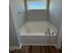 Bathroom featuring a soaking tub and window at 90 Faucette Dr, Selma, NC 27576