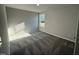 Bright bedroom with carpet and large window at 90 Faucette Dr, Selma, NC 27576