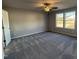 Bright bedroom with carpeted floors and ceiling fan at 90 Faucette Dr, Selma, NC 27576