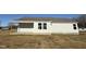 White house exterior with covered patio at 90 Faucette Dr, Selma, NC 27576