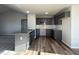Modern kitchen with dark gray cabinets and granite countertops at 90 Faucette Dr, Selma, NC 27576
