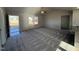 Spacious living room with carpeted floors and high ceilings at 90 Faucette Dr, Selma, NC 27576
